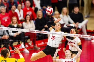 Nebraska Cornhusker Andi Jackson (15) spikes the ball against the Michigan Wolverines in the second set during the volleyball match on Friday, November 17, 2023, in Lincoln, Nebraska. Photo by John S. Peterson.