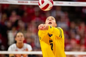 Michigan Wolverine Morgan Burke (7) digs the ball against the Nebraska Cornhuskers in the first set during the volleyball match on Friday, November 17, 2023, in Lincoln, Nebraska. Photo by John S. Peterson.