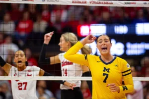 Michigan Wolverine Morgan Burke (7) celebrates a point against the Nebraska Cornhuskers in the first set during the volleyball match on Friday, November 17, 2023, in Lincoln, Nebraska. Photo by John S. Peterson.