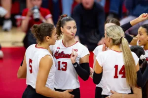 Nebraska Cornhusker Merritt Beason (13) makes a funny face reacting to the action on the court against the Michigan Wolverines in the third set during the volleyball match on Friday, November 17, 2023, in Lincoln, Nebraska. Photo by John S. Peterson.