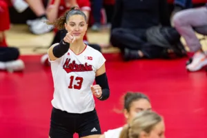 Nebraska Cornhusker Merritt Beason (13) celebrates a point against the Michigan Wolverines in the third set during the volleyball match on Friday, November 17, 2023, in Lincoln, Nebraska. Photo by John S. Peterson.