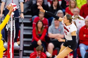 Nebraska Cornhusker Andi Jackson (15) spikes the ball against the Michigan Wolverines in the third set during the volleyball match on Friday, November 17, 2023, in Lincoln, Nebraska. Photo by John S. Peterson.
