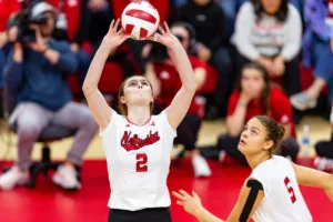 Nebraska Cornhusker Bergen Reilly (2) sets the ball against the Michigan Wolverines in the third set during the volleyball match on Friday, November 17, 2023, in Lincoln, Nebraska. Photo by John S. Peterson.