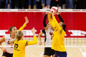 Michigan Wolverine Morgan Burke (7) sets the ball against the Nebraska Cornhuskers in the first set during the volleyball match on Friday, November 17, 2023, in Lincoln, Nebraska. Photo by John S. Peterson.