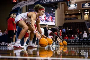 Nebraska Cornhusker forward Josiah Allick (53) does a dribbling drill for warm ups before the basketball game against the Oregon State Beavers on Saturday, November 18, 2023, in Sioux Falls, South Dakota. Photo by John S. Peterson.