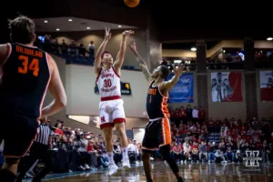 Nebraska Cornhusker guard Keisei Tominaga (30) shoots a three against Oregon State Beaver guard Christian Wright (1) in the first half during the basketball game on Saturday, November 18, 2023, in Sioux Falls, South Dakota. Photo by John S. Peterson.