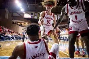 Nebraska Cornhusker forward Josiah Allick (53) helps guard Jamarques Lawrence (10) up in the first half during the basketball game on Saturday, November 18, 2023, in Sioux Falls, South Dakota. Photo by John S. Peterson.