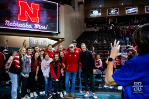 Nebraska Cornhusker head coach Fred Hoiberg poses for a photo with some fans after the win over the Oregon State Beavers during the basketball game on Saturday, November 18, 2023, in Sioux Falls, South Dakota. Photo by John S. Peterson.