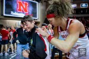 Nebraska Cornhusker forward Josiah Allick (53) signs an autograph for a fan after the win over Oregon State Beavers during the basketball game on Saturday, November 18, 2023, in Sioux Falls, South Dakota. Photo by John S. Peterson.