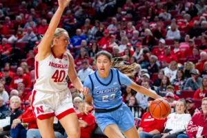 Creighton Bluejay guard Brittany Harshaw (23) drives to the basket against Nebraska Cornhusker center Alexis Markowski (40) in the second quarter during the basketball game on Sunday, November 19, 2023, in Lincoln, Nebraska. Photo by John S. Peterson.