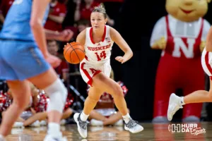 Nebraska Cornhusker guard Callin Hake (14) dribbles the ball down the court against the Creighton Bluejays in the third quarter during the basketball game on Sunday, November 19, 2023, in Lincoln, Nebraska. Photo by John S. Peterson.