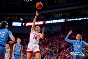 Nebraska Cornhusker guard Callin Hake (14) makes a layup against the Creighton Bluejays in the third quarter during the basketball game on Sunday, November 19, 2023, in Lincoln, Nebraska. Photo by John S. Peterson.