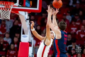 Nebraska Cornhusker forward Josiah Allick (53) tries to block a shot from Duquesne Duke forward Andrei Savrasov (23) in the first half during the college basketball game on Wednesday November 22, 2023, in Lincoln, Neb. Photo by John S. Peterson.
