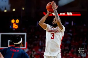 Nebraska Cornhusker guard Brice Williams (3) makes a three against Duquesne Duke guard Jimmy Clark III (1) early in the first half during the college basketball game on Wednesday November 22, 2023, in Lincoln, Neb. Photo by John S. Peterson.