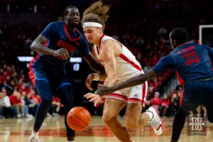 Nebraska Cornhusker forward Josiah Allick (53) fights through Duquesne Duke forward Hassan Drame (33) and forward Fousseyni Drame (34) in the first half during the college basketball game on Wednesday November 22, 2023, in Lincoln, Neb. Photo by John S. Peterson.