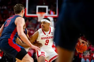 Nebraska Cornhusker guard Jarron Coleman (9) dribbles the ball against the Duquesne Dukes in the first half during the college basketball game on Wednesday November 22, 2023, in Lincoln, Neb. Photo by John S. Peterson.