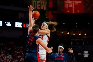 Nebraska Cornhusker forward Josiah Allick (53) makes a basket against Duquesne Duke forward Andrei Savrasov (23) in the first half during the college basketball game on Wednesday November 22, 2023, in Lincoln, Neb. Photo by John S. Peterson.
