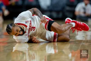 Nebraska Cornhusker guard Brice Williams (3) falls to the floor getting tripped up by Duquesne Duke guard Jimmy Clark III in the second half during the college basketball game on Wednesday November 22, 2023, in Lincoln, Neb. Photo by John S. Peterson.
