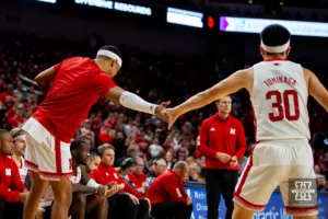 Nebraska Cornhusker guard Jarron Coleman (9) gives Keisei Tominaga (30) five after a basket against the Duquesne Dukes in the second half during the college basketball game on Wednesday November 22, 2023, in Lincoln, Neb. Photo by John S. Peterson.