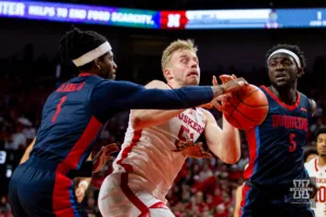 Nebraska Cornhusker forward Rienk Mast (51) fights for the ball against Duquesne Duke guard Jimmy Clark III (1) and forward Halil Barre (5) in the second half  during the college basketball game on Wednesday November 22, 2023, in Lincoln, Neb. Photo by John S. Peterson.