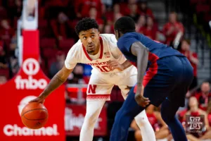 Nebraska Cornhusker guard Jamarques Lawrence (10) dribbles the ball against Duquesne Duke forward Fousseyni Drame (34) in the second half during the college basketball game on Wednesday November 22, 2023, in Lincoln, Neb. Photo by John S. Peterson.