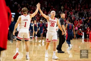 Nebraska Cornhusker guard Sam Hoiberg (1) and guard Keisei Tominaga (30) give each other a high five after the win over Duquesne Dukes during the college basketball game on Wednesday November 22, 2023, in Lincoln, Neb. Photo by John S. Peterson.