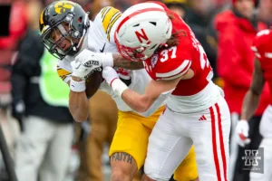 Nebraska Cornhusker defensive back Phalen Sanford (37) knocks Iowa Hawkeye wide receiver Kaleb Brown (3) out of bounds in the second quarter during the football game on Thursday, November 24, 2023, in Lincoln, Neb. Photo by John S. Peterson.