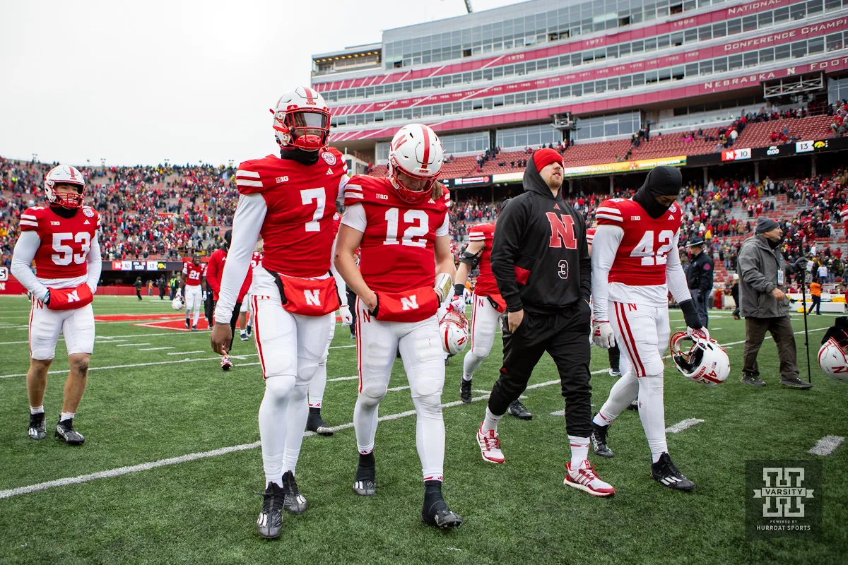 Nebraska Cornhusker quarterback Chubba Purdy (12)  walks off the field with quarterback Jeff Sims (7)  after the loss to Iowa Hawkeyes in the final seconds during the football game on Thursday, November 24, 2023, in Lincoln, Neb. Photo by John S. Peterson.