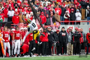 Nebraska Cornhusker wide receiver Malachi Coleman (15) misses a catch in the last minutes of the game against Iowa Hawkeye defensive back Deshaun Lee (8) in the fourth quarter during the football game on Thursday, November 24, 2023, in Lincoln, Neb. Photo by John S. Peterson.