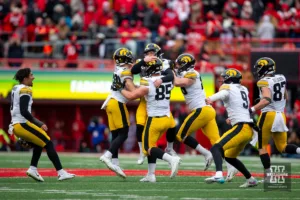 The Iowa Hawkeyes  celebrates the field goal to win the game against the Nebraska Cornhuskers in the finals seconds of game on Thursday, November 24, 2023, in Lincoln, Neb. Photo by John S. Peterson.