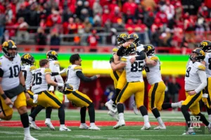 Iowa Hawkeyes celebrate their win over the Huskers in the final seconds during the football game on Thursday, November 24, 2023, in Lincoln, Neb. Photo by John S. Peterson.