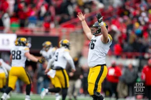 Iowa Hawkeye offensive lineman Tyler Elsbury (76) celebrates the win over the Huskers by a field goal in the final seconds during the football game on Thursday, November 24, 2023, in Lincoln, Neb. Photo by John S. Peterson.