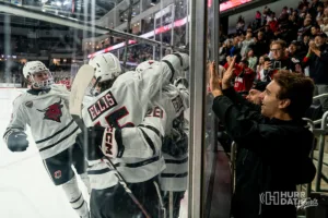 Omaha Mavericks celebrate during a game against St. Cloud State at Baxter Arena in Omaha, NE December 8th 2023. Photo by Eric Francis