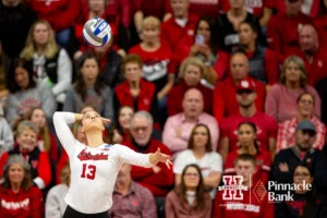 Nebraska Cornhusker Merritt Beason (13) serves the ball against the Long Island Sharks in the second set during the first round of the NCAA volleyball championships on Friday, December 1, 2023, in Lincoln, Neb. Photo by John S. Peterson.