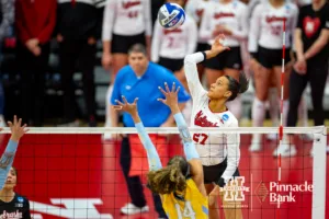 Nebraska Cornhusker Harper Murray (27) spikes the ball against the Long Island Sharks in the first setduring the first round of the NCAA volleyball championships on Friday, December 1, 2023, in Lincoln, Neb. Photo by John S. Peterson.