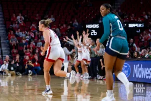 Nebraska Cornhusker guard Callin Hake (14) runs back down court after making a three agaisnt UNC Wilmington Seahawk guard Britany Range (0) in the first half during a college basketball game Tuesday, December 5, 2023, in Lincoln, Neb. Photo by John S. Peterson.