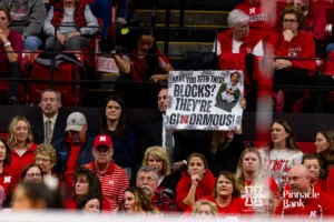 Nebraska Cornhuskers fan hold up a sign against the Georgia Tech Yellow Jackets during the third round in the NCAA Volleyball Championship match Thursday, December 7, 2023, Lincoln, Neb. Photo by John S. Peterson.