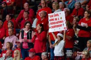 Nebraska Cornhuskers fan holds up a sign against the Georgia Tech Yellow Jackets during the third round in the NCAA Volleyball Championship match Thursday, December 7, 2023, Lincoln, Neb. Photo by John S. Peterson.