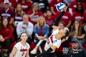 Nebraska Cornhusker Merritt Beason (13) spikes the ball against the Arkansas Razorbacks in the second set during the third round in the NCAA Volleyball Championship match on Saturday, December 9, 2023, Lincoln, Neb. Photo by John S. Peterson.