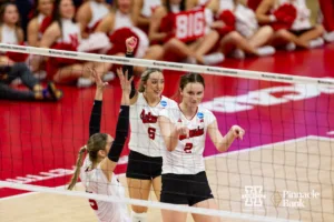 Nebraska Cornhusker Bergen Reilly (2) points down signaling a score against the Arkansas Razorbacks in the third set during the Regional Championship match in the NCAA Volleyball Championship Thursday, December 7, 2023, Lincoln, Neb. Photo by John S. Peterson.