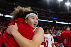 Nebraska Cornhusker guard Keisei Tominaga (30) gives Josiah Allick (53) a hug celebrating the win over the Michigan State Spartans during the college basketball game Sunday, December 10, 2023, Lincoln, Neb. Photo by John S. Peterson.