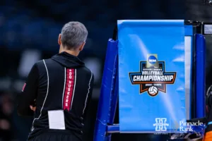 Nebraska Cornhusker head coach John Cook walks around the referee stand while watching open practice before the NCAA Semi-Finals, Wednesday, December 13, 2023, Tampa, Florida. Photo by John S. Peterson.