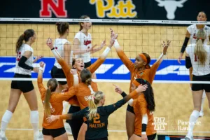 Texas Longhorns celebrates a point against the Nebraska Cornhuskers during the NCAA Finals on Sunday, December 17, 2023, in Tampa, Florida. Photo by John S. Peterson.