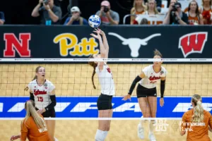 Nebraska Cornhusker setter Bergen Reilly (2) sets the ball against the Texas Longhorns in the second set during the NCAA Finals on Sunday, December 17, 2023, in Tampa, Florida. Photo by John S. Peterson.