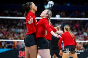 Nebraska Cornhuskers Harper Murray (27) and Laney Choboy (6) bump during warm ups before taking on the Texas Longhorns in the NCAA Finals on Sunday, December 17, 2023, in Tampa, Florida. Photo by John S. Peterson.