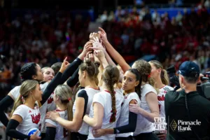 Nebraska Cornhuskers huddle up before taking on the Texas Longhorns during the NCAA Finals on Sunday, December 17, 2023, in Tampa, Florida. Photo by John S. Peterson.