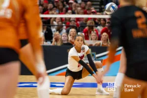 Nebraska Cornhusker outside hitter Merritt Beason (13) digs the ball against the Texas Longhorns in the second set during the NCAA Finals on Sunday, December 17, 2023, in Tampa, Florida. Photo by John S. Peterson.