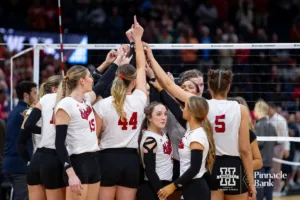 Nebraska Cornhuskers huddles up at the end of the match against the Texas Longhorns during the NCAA Finals on Sunday, December 17, 2023, in Tampa, Florida. Photo by John S. Peterson.