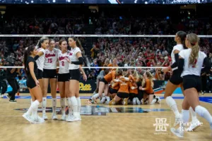 Nebraska Cornhuskers come together after Texas won match point in three sets during the NCAA Finals on Sunday, December 17, 2023, in Tampa, Florida. Photo by John S. Peterson.