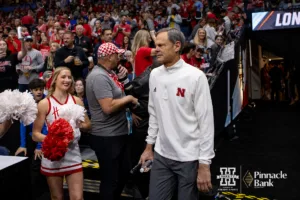 Nebraska Cornhusker head coach John Cook makes his way to the court against the Texas Longhorns during the NCAA Finals on Sunday, December 17, 2023, in Tampa, Florida. Photo by John S. Peterson.